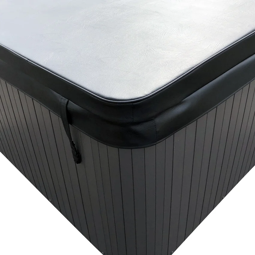 Spa cover corner showing vinyl, skirt, and locking strap.